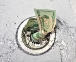 Money-Down-Drain.webp